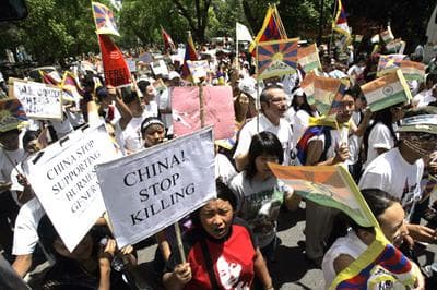 Tibetan exiles protested the Beijing Olympics torch rally and demanded Tibet's independence in New Delhi, India, on Thursday, April 17, 2008. (AP Photo/Gautam Singh)