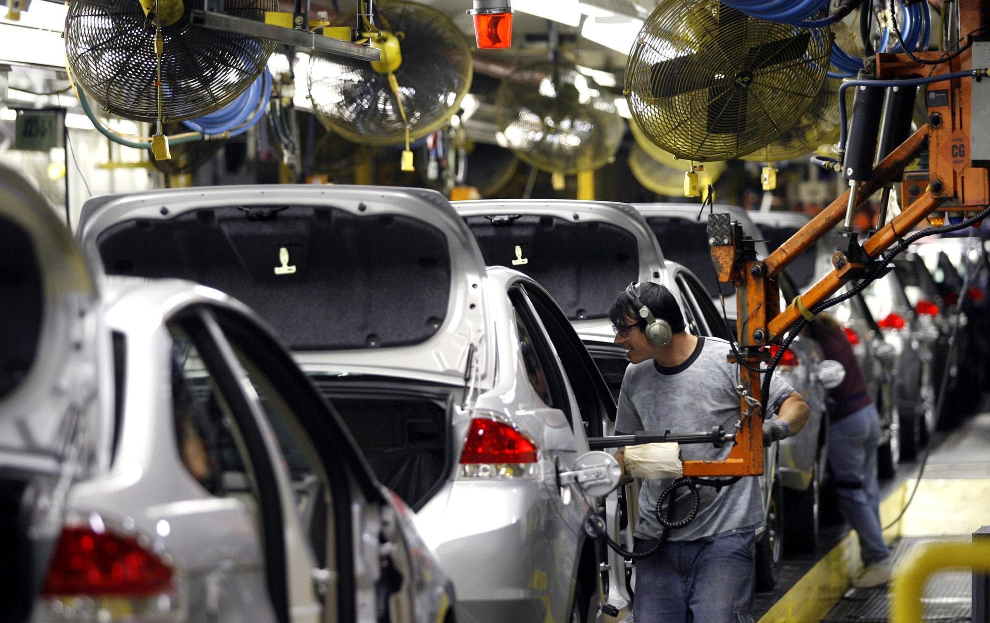 Ford workers assemble the new 2008 Ford Focus in Wayne, Mich., May. 30, 2008. (AP Photo/Gary Malerba)