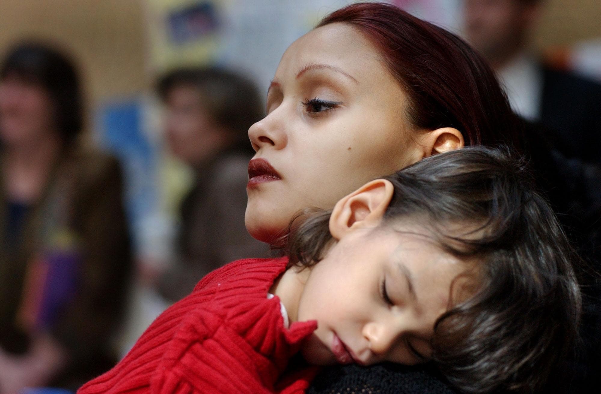 A teen mother and her son in Boston, MA in March, 2003. (AP Photo/Patricia McDonnell)