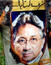 A portrait of Pakistan's President Pervez Musharraf is burnt by demonstrators during a rally in Multan, Pakistan on Aug. 14, 2008. (AP Photo/Khalid Tanveer)