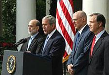 President George W. Bush with Federal Reserve Chairman Ben Bernanke, left, SEC Chairman Chris Cox, right, and Treasury Secretary Hank Paulson as he delivers a statement on the economy Friday, Sept. 19, 2008, in the Rose Garden of the White House. Photo by Joyce N. Boghosian