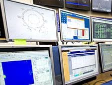Computer screens in the Atlas control room capture the movements of the first beams circulating the Large Hadron Collider in Geneva, Switzerland on September 10, 2008.