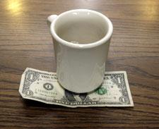 A tip is left by a customer at Linda's Place Restaurant in St. Clair Shores, Mich., in June 2008.  (AP Photo/Paul Sancya)