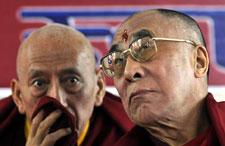 Tibetan spiritual leader the Dalai Lama, right, confers with Samdhong Rinpoche, Prime Minister of the Tibetan government-in-exile, during a function in Dharmsala, India, Thursday, Nov. 20, 2008. A summit of Tibetan exiles is turning into a clash of generations over the direction of their struggle with China. (AP Photo/Ashwini Bhatia)