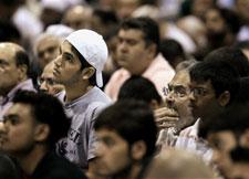 Worshippers listen to the Khutba during Friday Prayer at the 43rd annual Islamic Society of North America convention Friday, Sept, 1, 2006 in Rosemont, Ill. (AP Photo/M. Spencer Green)