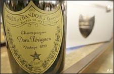 A rare bottle of 1995 Dom Perignon being sold for $14,950 is seen with its case in New York, Wednesday, Dec. 13, 2006. The $15,000 bottle of bubbly is just one example of how record Wall Street bonuses this year can trickle through New York City's economy. (AP Photo/Seth Wenig)
