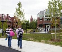 Students walk in the campus at Wells College in Aurora, N.Y. in Sept. 2007.  (AP Photo/Kevin Rivoli) 