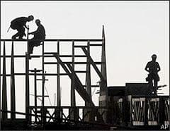 Workers are seen on the frame of a building under construction in Folsom, Calif., Tuesday, Jan. 13, 2009. American consumers and businesses cut back everywhere in the final three months of 2008. Shoppers chopped spending on cars, furniture, appliances, clothes and other items. Businesses dropped the ax on equipment and software, home building and commercial construction. And overseas sales of U.S.-made goods and services tanked as foreign buyers grappled with their own economic woes. (AP)