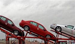 General Motor autos sit on the top of a car carrier at the General Motors Assembly Plant on Wednesday, Feb. 18, 2009 in Lordstown, Ohio. Shares of General Motors Corp. climbed in premarket trading on Wednesday after it and crosstown rival Chrysler LLC submitted restructuring plans and requests for billions more in aid to the U.S. government. (AP Photo/Mark Stahl)