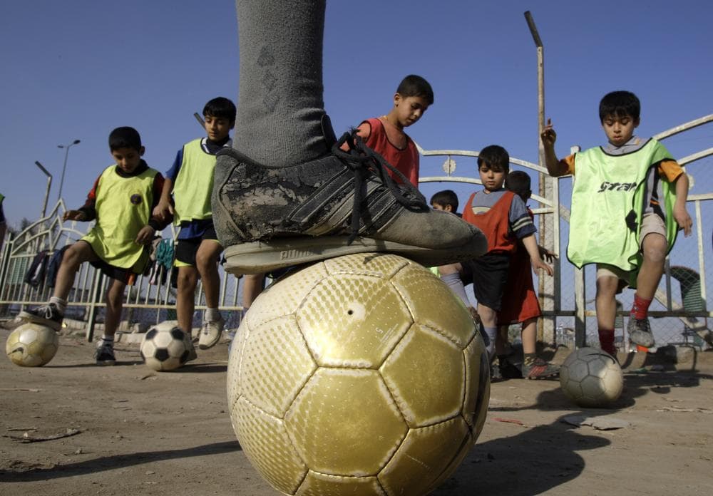 Children attend soccer practice in the Shiite neighborhood of Sadr City in Baghdad, Iraq, Jan. 25, 2009. (AP)