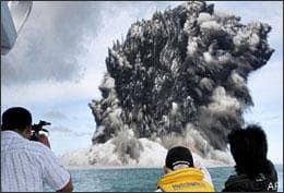 Spectators watch as an undersea volcano erupts off the coast of Tonga, tossing clouds of smoke, steam and ash thousands of feet (meters) into the sky above the South Pacific ocean, Wednesday, March 18, 2009. The eruption was at sea about 6 miles (10 kilometers) from the southwest coast off the main island of Tongatapu, an area where up to 36 undersea volcanoes are clustered. (AP)