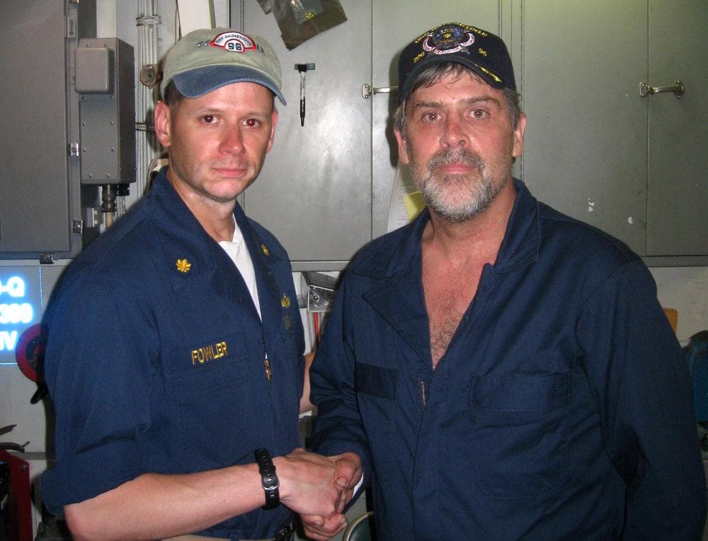 Maersk-Alabama Capt. Richard Phillips, right, shakes hands with Lt. Cmdr. David Fowler, executive officer of USS Bainbridge after being rescued by U.S Naval Forces off the coast of Somalia. (AP/ U.S. Navy)