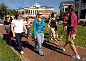 Erin O'Connell, center, and her mother Rosemary O'Connell, left, follow a group tour through Elon University, Monday, Oct. 13, 2008, in Elon, N.C. It's college-visiting season for the high school class of 2009, which will send the most ever graduates on to college next fall. But the souring economy and dramatic slump on Wall Street are providing a cold dose of financial reality for many families. (AP)