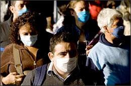 Residents wear surgical masks as they exit the subway in Mexico City, Monday, April 27, 2009. Mexico's government is trying to stem the spread of a deadly strain of swine flu as a new work week begins by urging people to stay home Monday if they have any symptoms of the virus believed to have killed more than 100 people. (AP)