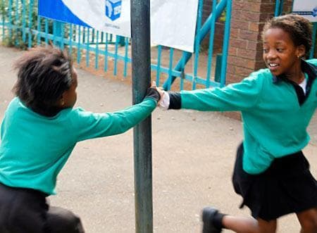Children play outside Melpark Primary school, to be used as a polling station, in Johannesburg Tuesday, April 21, 2009. (AP)