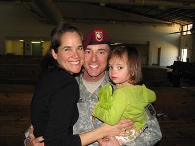 Kelly Wright, her husband, and their daughter, at his homecomeing from his latest deployment.