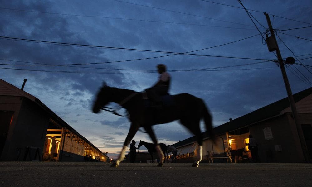 A jockey makes his way to the track for a training session in preparation for the 135th Kentucky Derby at Churchill Downs Thursday, in Louisville, Ky. (AP)