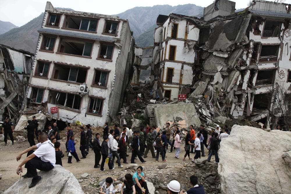 People visit the quake devastated town of Beichuan, southwestern China's Sichuan province, Tuesday, May 12 , 2009. (AP)