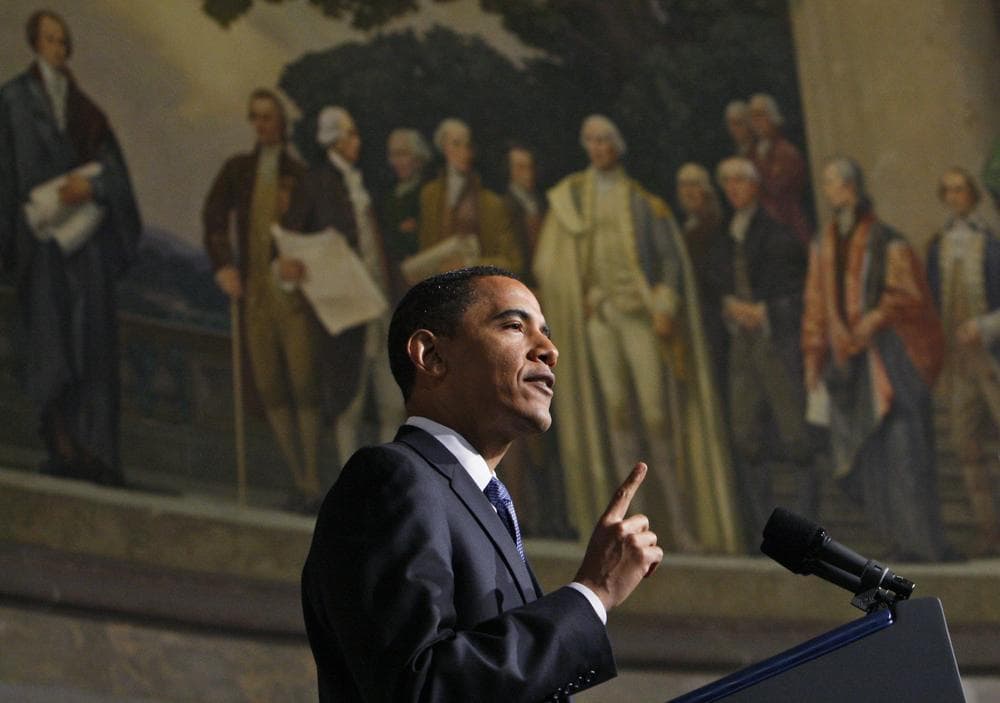 President Barack Obama delivers an address on national security, terrorism, and the closing of Guantanamo Bay prison, Thursday, May 21, 2009, at the National Archives in Washington. Above is a mural painted by Barry Faulkner in 1936 of the Constitution Convention depicting James Madison delivering the final draft of the Constitution to George Washington. (AP)
