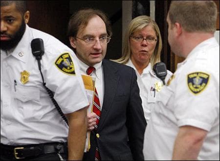 Court officers escort Christian Karl Gerhartsreiter, who calls himself Clark Rockefeller, into the courtroom for the first day of his trial at Suffolk Superior Court in Boston on Thursday. (AP Photo)