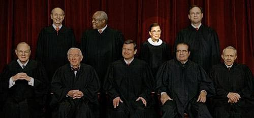 Members of the U.S. Supreme Court sit for a group portrait at the Supreme Court in Washington in this March 3, 2006 file photo. (AP Photo/J. Scott Applewhite, File)