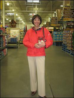 BJ's CEO Laura Sen holds her favorite item: chocolate-covered raisins, at the Framingham store. (Sarah Bush/WBUR)