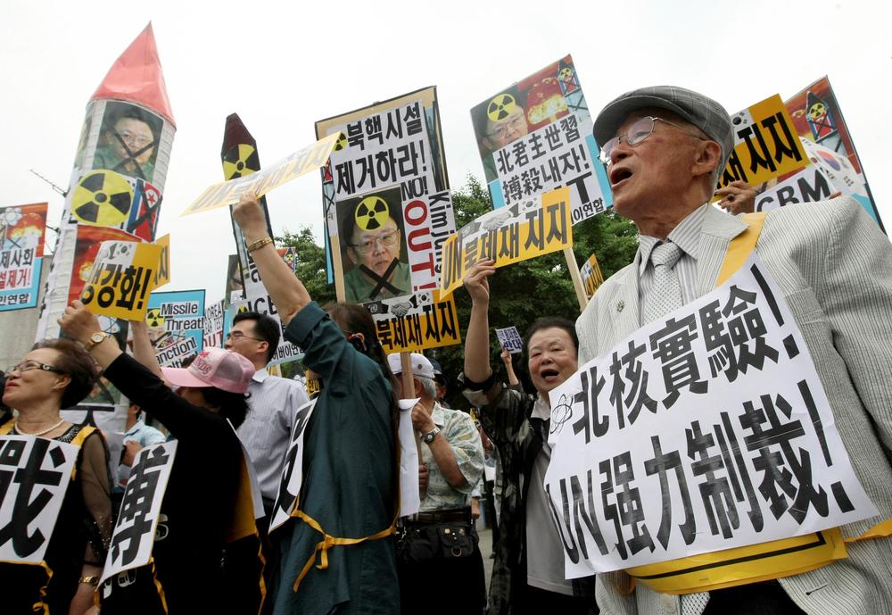 South Korean protesters and North Korean defectors shout slogans during a rally against North Korea's nuclear test and missiles in Seoul, South Korea, Tuesday, June 2, 2009. North Korea is preparing to launch three or four medium-range missiles, along with an intercontinental ballistic missile, amid moves by Kim Jong Il to anoint his third son as heir to the world's first communist dynasty, reports and experts said Tuesday. &quot;The Korean reads &quot;Remove North Korea nuclear.&quot;   (AP) 