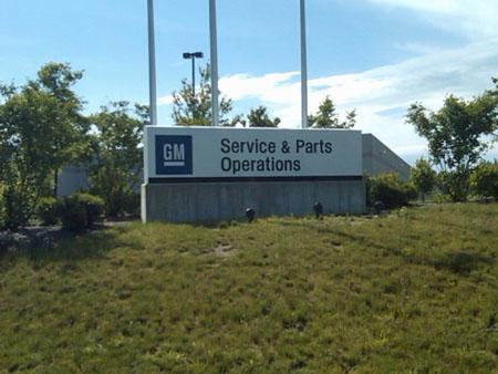 The sign outside the General Motors auto parts warehouse and distribution center in Norton, Mass. (Steve Brown/WBUR)