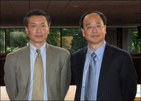 Cernet’s Daniel Xu (left) and UMass China Institute Executive Director Allan Guo. (Deborah Becker/WBUR)