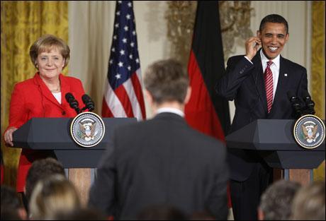 President Barack Obama and German Chancellor Angela Merkel listen to a reporters question as they participate in a joint news conference, Friday, at the White House. Obama said the United States and Germany share “one voice” in condemning the Iranian effort to crush dissent. (AP Photo)
