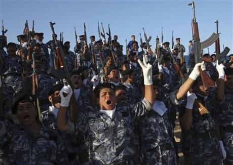 Iraqi security forces celebrate in Ramadi, the capital of Anbar province, Monday. U.S. troops will be out of Iraqi cities by Tuesday in the first step toward winding down the American war effort by the end of 2011. (AP Photo) 