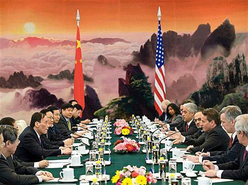 U.S. Treasury Secretary Timothy Geithner, third from right, speaks during a meeting with Chinese Vice Premier Wang Qishan, third from left, at the Great Hall of the People in Beijing, China, Monday, June 1, 2009. Geithner said Monday that the global recession seemed to be losing force but that it will be critical for the United States and China to
