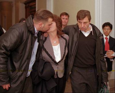 Robert Curley, right, father of 10-year-old murder victim Jefferey Curley, both of Cambridge, Mass., departs the Statehouse in Boston with his wife and a relative moments after the Massachusetts House of Representatives voted to approve a bill to reinstate the death penalty in the state Oct. 28, 1997. (AP Photo)