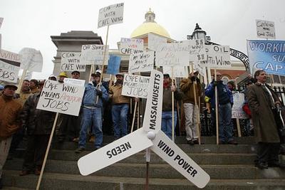 Supporters of the plan to put wind turbines on the coast of Cape Cod gather outside the State House in Boston on March 9, 2004. (AP Photo)