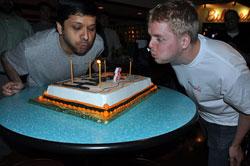 CTO and Co-Founder Dharmesh Shah and Developer Patrick Fitzsimmons blow out birthday cake candles at a bowling party celebrating the company's third birthday. (AP Photo)