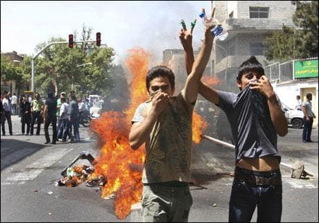 This photo, taken by an individual not employed by the Associated Press and obtained by the AP outside Iran, shows two opposition demonstrators flashing victory sign during a protest in Tehran, Iran, Friday. (AP Photo)