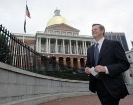 Republican Charles Baker walks past the State House on Wednesday after filing paperwork to officially become a candidate for Massachusetts governor in the 2010 campaign. (AP)