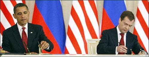 President Barack Obama and Russia's President Dmitry Medvedev sign a preliminary agreement to reduce the world's two largest nuclear stockpiles by as much as a third, to the lowest levels of any U.S.-Russia accord, before a joint news conference at the Kremlin in Moscow, Monday, July 6, 2009. (AP)