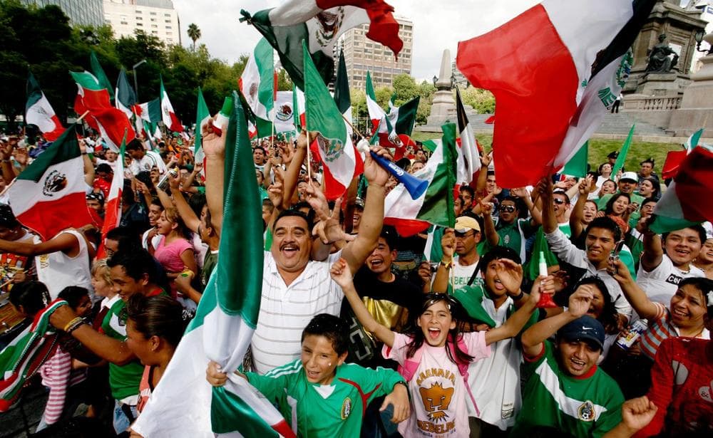 Mexican soccer fans in Mexico City celebrate their team's victory against the United States in the CONCACAF Gold Cup soccer final Sunday. Mexico won 5-0. (AP Photo/Marco Ugarte)