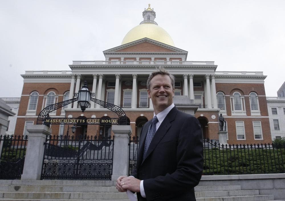 Republican Charles Baker walks past the State House after filing paperwork to become a candidate for Massachusetts governor in the 2010 campaign. Right after filing the paperwork, Baker sat down with WBUR's Bob Oakes to discuss his run. (AP Photo)