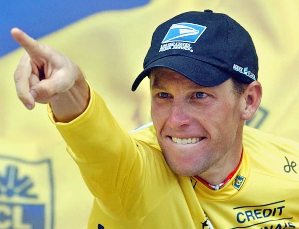 Lance Armstrong celebrates on the podium after winning the 15th stage of the Tour de France cycling race between Bagneres-de-Bigorre and Luz-Ardiden, French Pyrenees, Monday, July 21, 2003. (AP Photo/Christophe Ena)