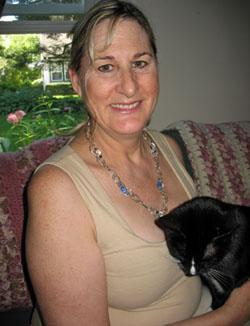 Sandra Herforth at home with her cat. (Monica Brady-Myerov/WBUR)