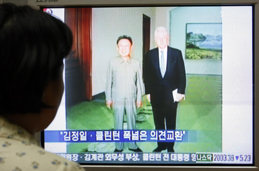A South Korean woman watches a TV broadcasting news report on former U.S. President Bill Clinton meets with North Korean leader Kim Jong Il in Seoul, South Korea, Tuesday, Aug, 4, 2009. Former President Bill Clinton met Tuesday with North Korean leader Kim Jong Il on the first day of a surprise visit to Pyongyang, with the &quot;exhaustive&quot; talks covering a wide range of topics, state-run media said. (AP)