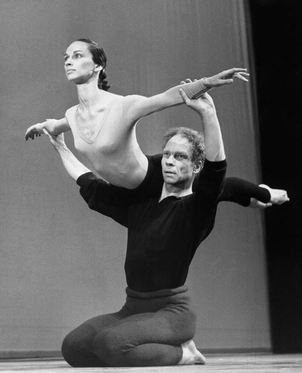 FILE- In This July 27, 1964 file photo, Merce Cunningham lifts Carolyn Brown during rehearsal at Sadler Wells Theater in London, England. On Tuesday, June 9, 2009, the Cunningham Dance Foundation announced that will close after a two-year international tour and New York performance, to document Cunningham's cutting-edge movements, along with sets and costumes, so they can be studied and performed when he can no longer lead his dance company. (AP)