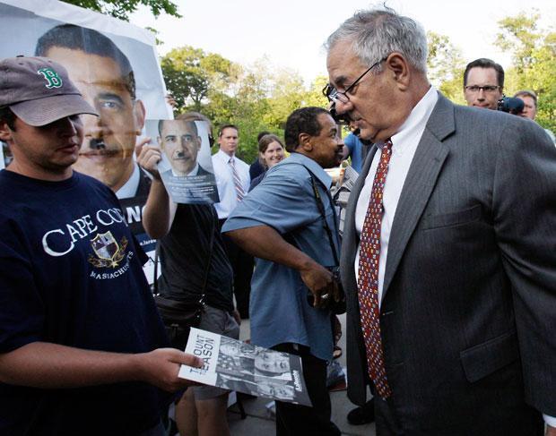U.S. Rep. Barney Frank, D-Mass., right, is presented with literature as he enters a senior center in Dartmouth on Tuesday. (AP)