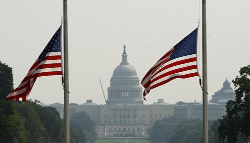 The U.S. Capitol is seen in the background as flags fly at half-staff at the Washington Monument in Washington, Wednesday, Aug. 26, 2009, in honor of the passing of Sen. Edward Kennedy, D-Mass. (AP)
