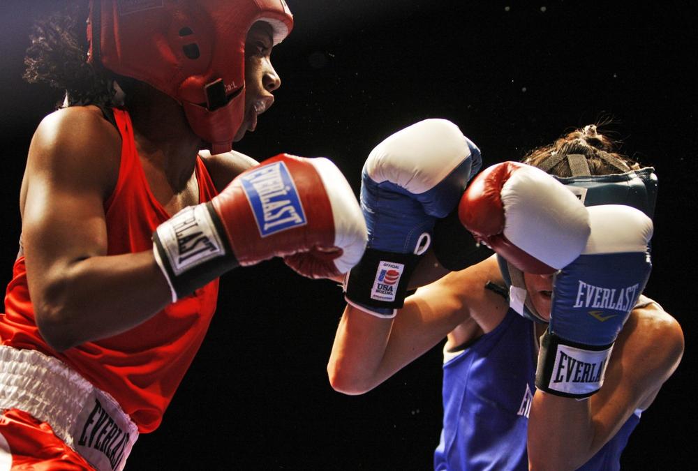 Sacred Downing, left, lands a punch against Rita Martinez during their women's championship featherweight bout at the U.S. Boxing Championships in Denver in Feb. 2009.