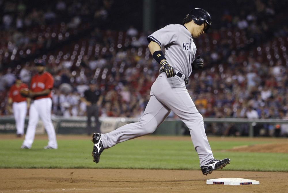 New York's Hideki Matsui rounds third after hitting a three run home run, his second of the night, against Boston during the ninth inning at Fenway on Friday. (AP)