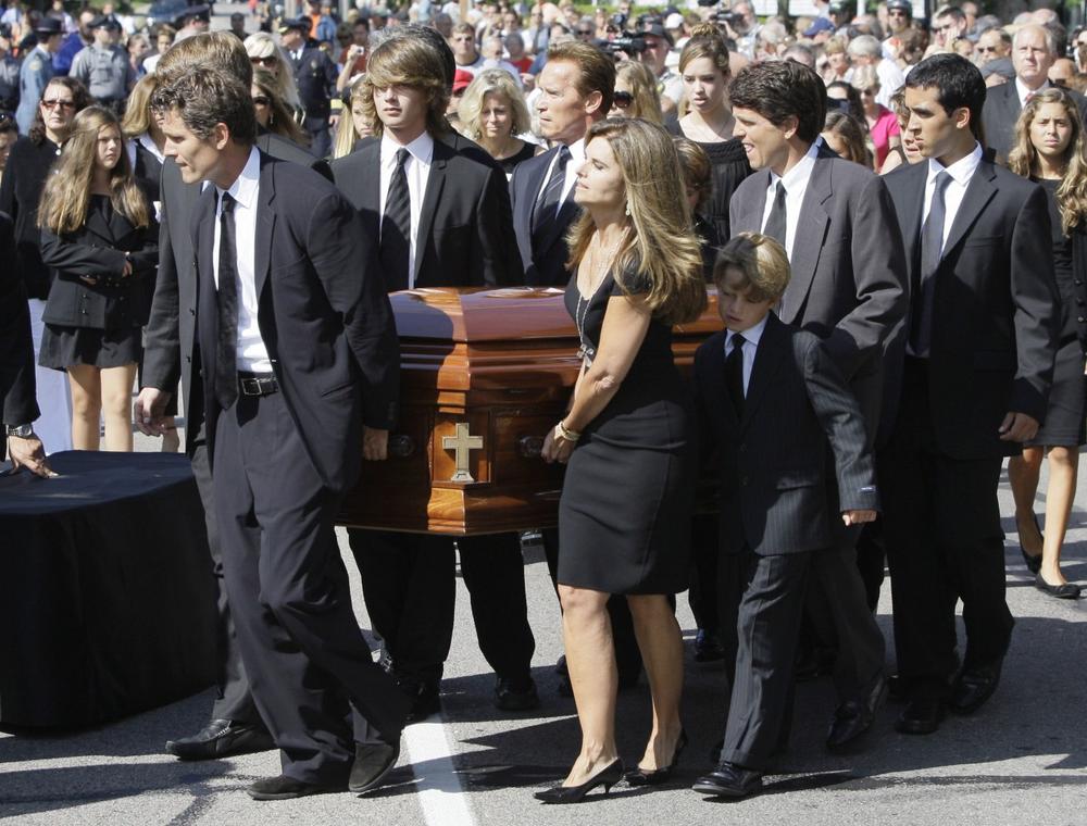 Members of the Shriver family bear the casket of Eunice Kennedy Shriver into Saint Francis Xavier Roman Catholic Church in Hyannis on Friday. (AP) 