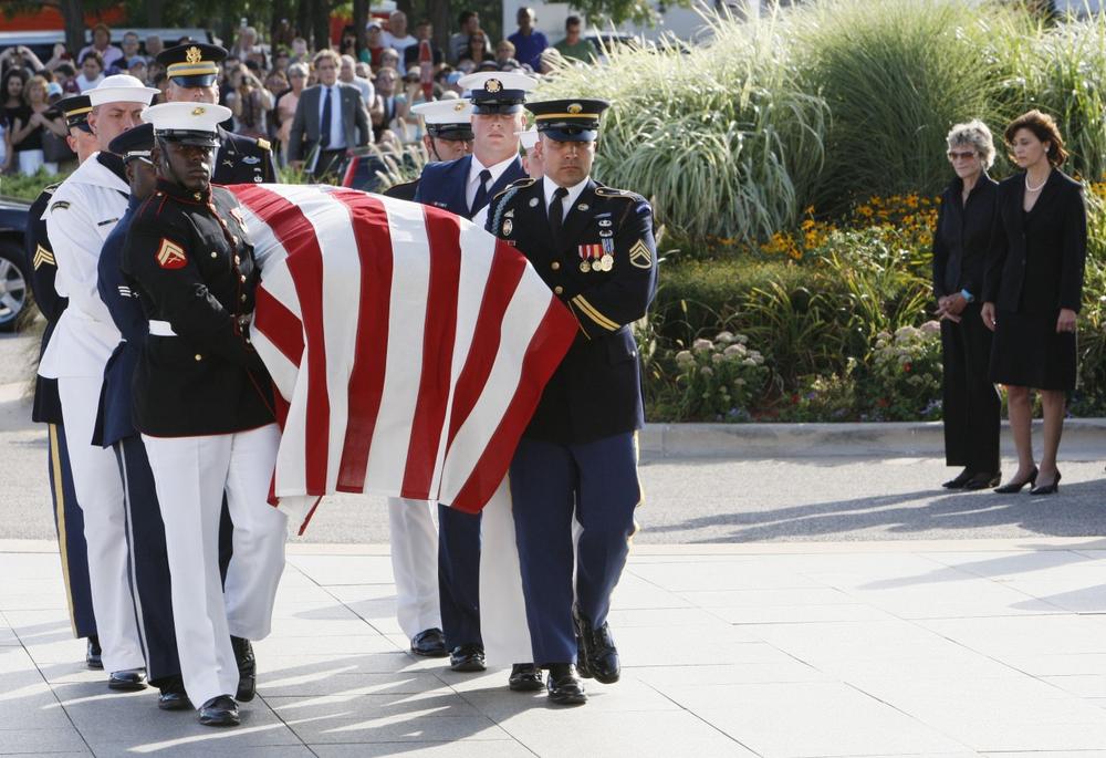 Victoria Kennedy, right, and Jean Kennedy Smith, second right, look on as an honor guard carries the casket of Sen. Edward Kennedy as it arrives at the John F. Kennedy Presidential Library, Thursday, Aug. 27, 2009 in Boston.